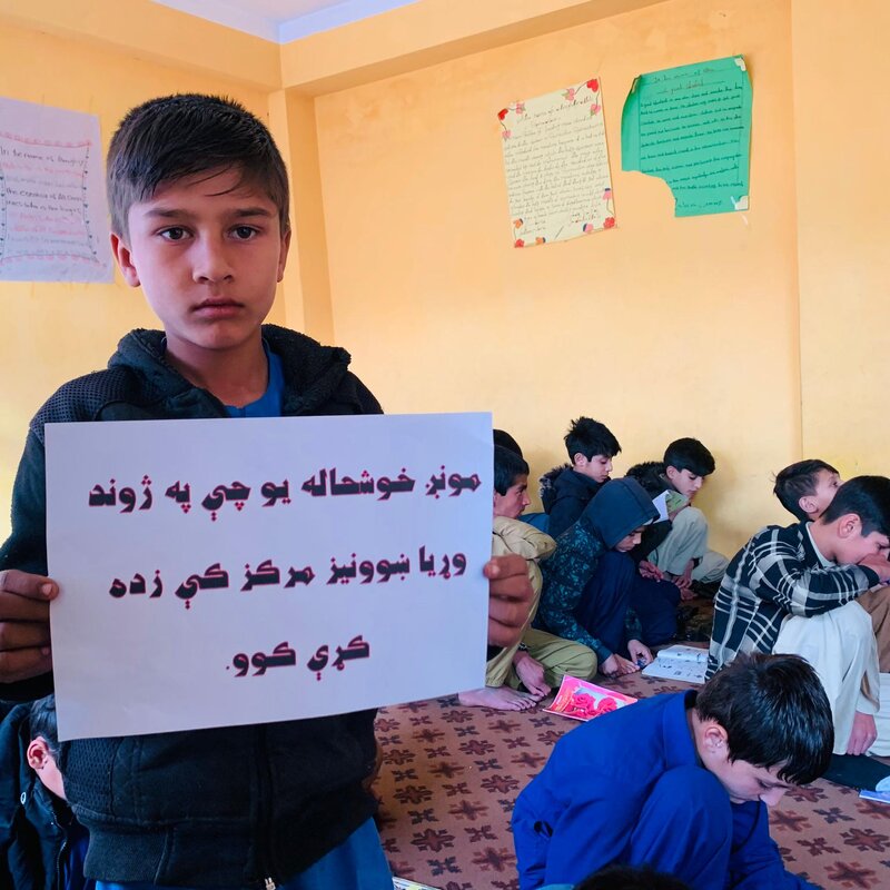 Happy student studying at Zhwand Educational Center